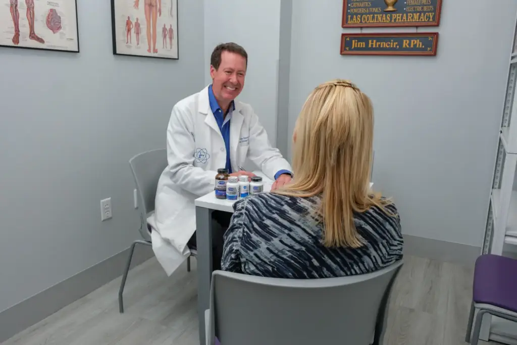 Jim Hrncir RPh consulting with a patient